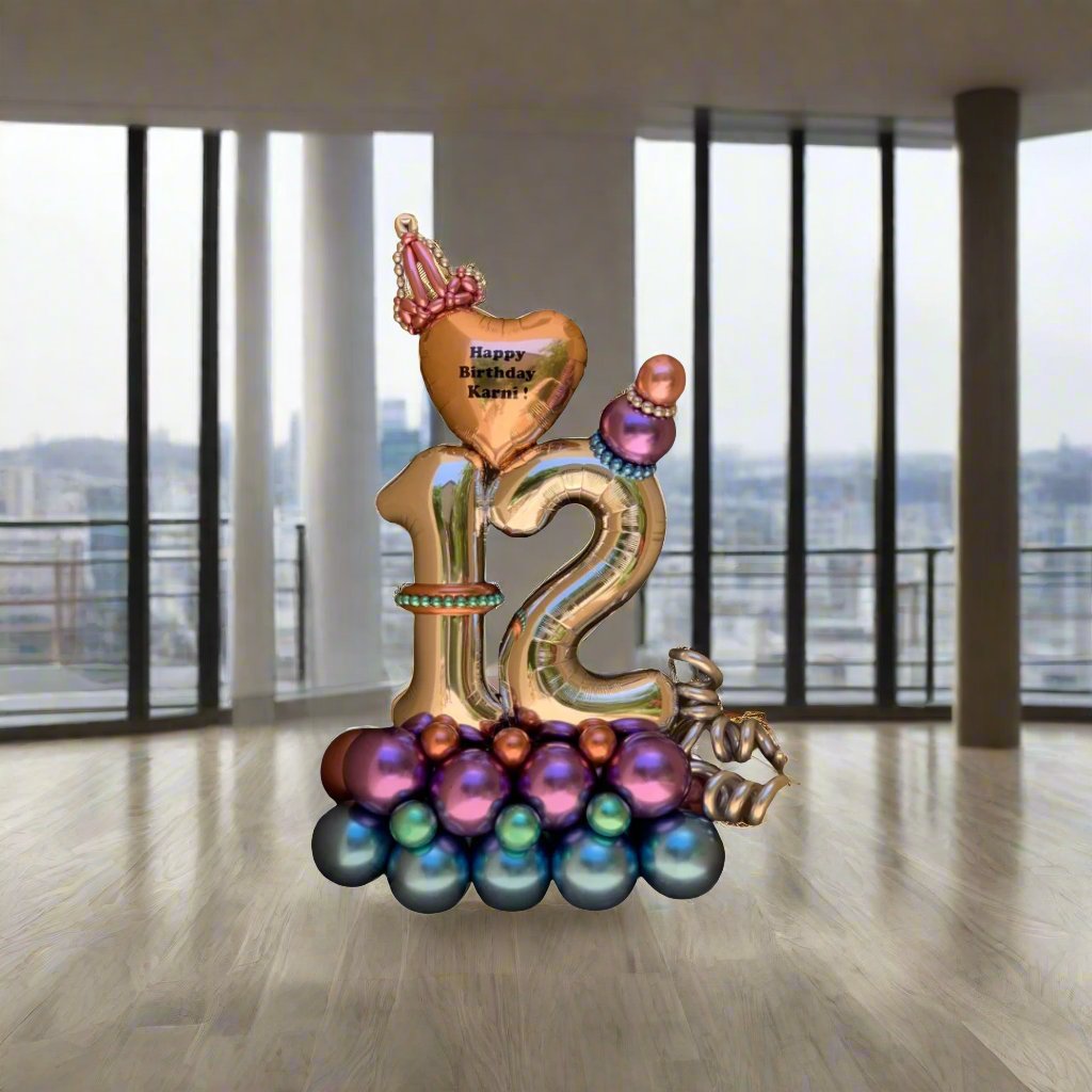 Personalized royal-themed balloon arrangement with gold heart and crown