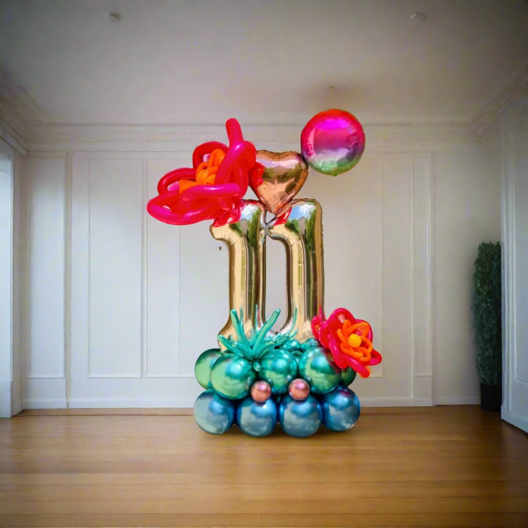Flower Power balloon display with colorful flowers and a heart centerpiece, customizable with any number.