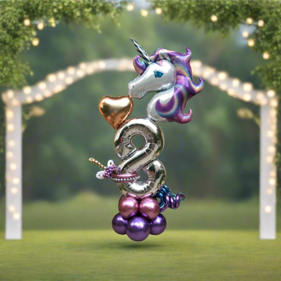 Balloon arrangement featuring a magical unicorn and bright, colorful accents for birthday parties.
