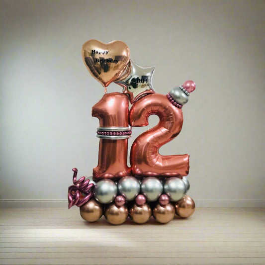 Golden Heart Celebration balloon display with metallic gold and pink balloons and a personalized heart.