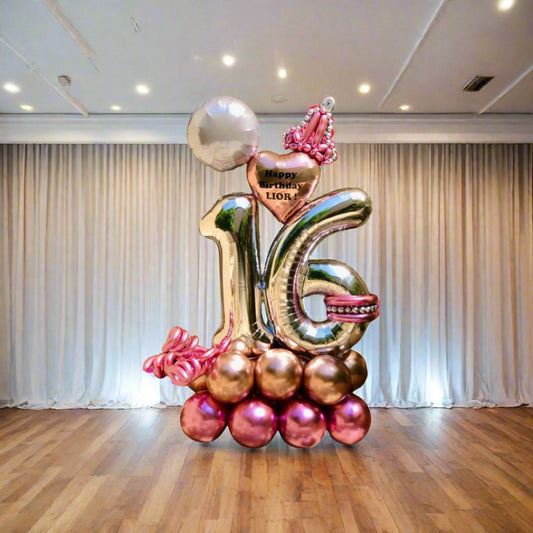 Majestic Celebration balloon display with crown, heart, and metallic pink and gold balloons.