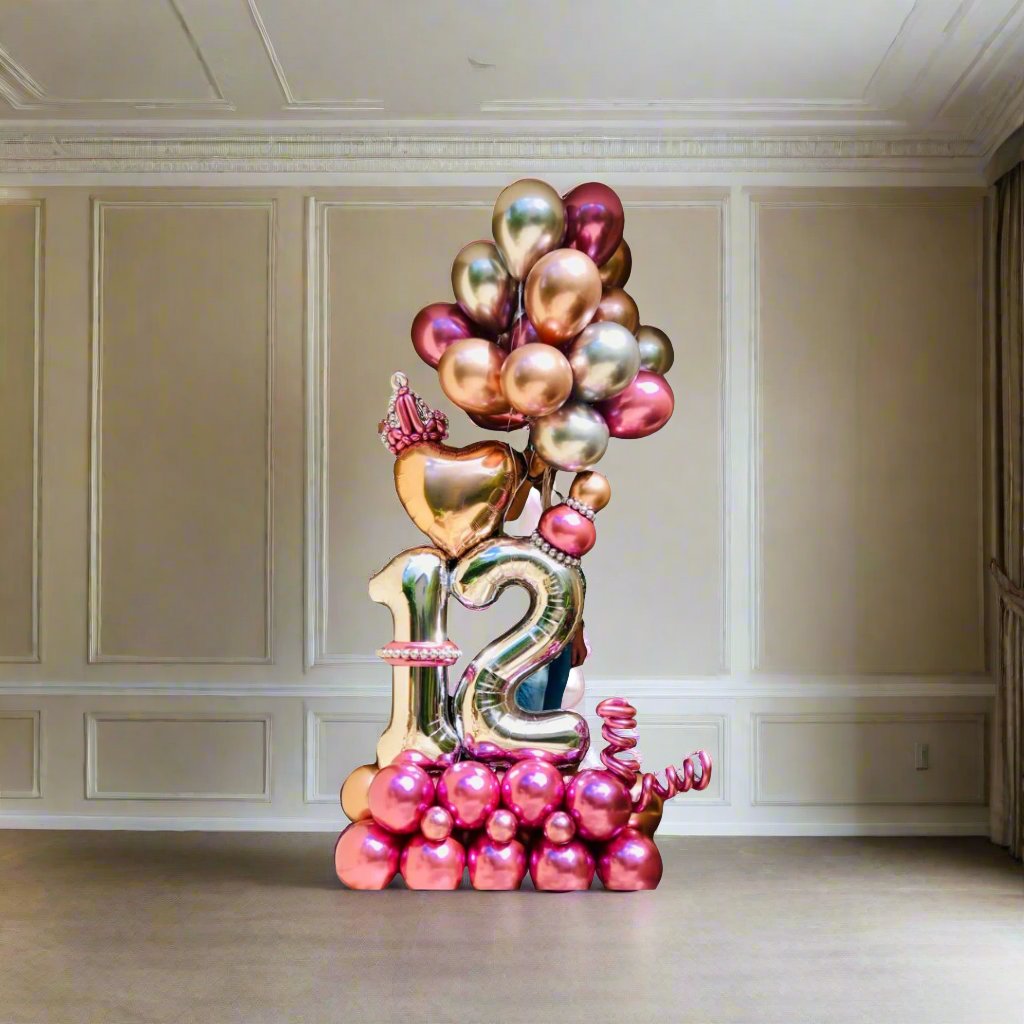 Princess Celebration balloon display with crown, heart, and metallic accents, perfect for royal-themed events.
