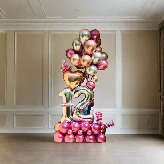 Princess Celebration balloon display with crown, heart, and metallic accents, perfect for royal-themed events.