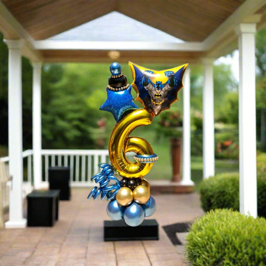 Superhero Swing balloon display with a star and custom number balloon, perfect for themed parties.